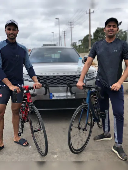 A duplicate shot of two clients with their bikes, ready for a training ride on the open road.