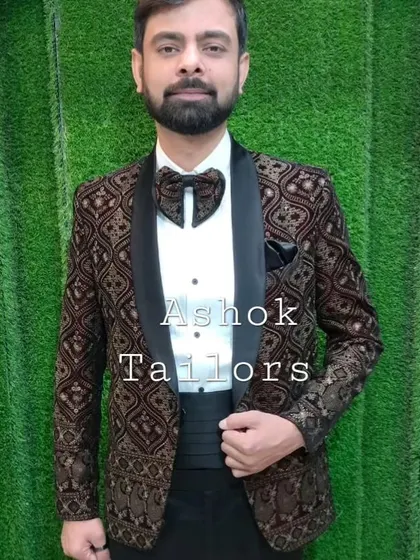 A customer looking sharp in our patterned tuxedo jacket. The unique fabric and the butterfly bow tie make for a very stylish and individual look.