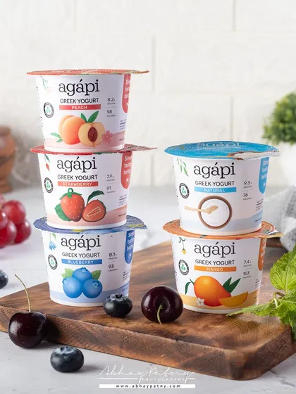 Stacking products is a simple yet effective way to show the different variants a brand offers. This shot for a yogurt brand is clean, bright, and clearly displays the flavor options available to the customer.