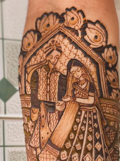 The final, filled-in portrait of a bride and groom, framed by lotus motifs.
