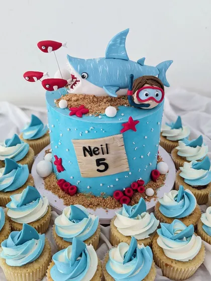For Neil's fifth birthday, we went with a shark theme, complete with a friendly fondant shark, a little diver, and matching cupcakes.