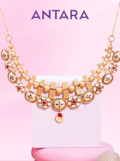 Geometry, but make it iconic. Sharp lines, effortless curves, and a play of 22kt matte gold create a statement of power and poise in this necklace.
