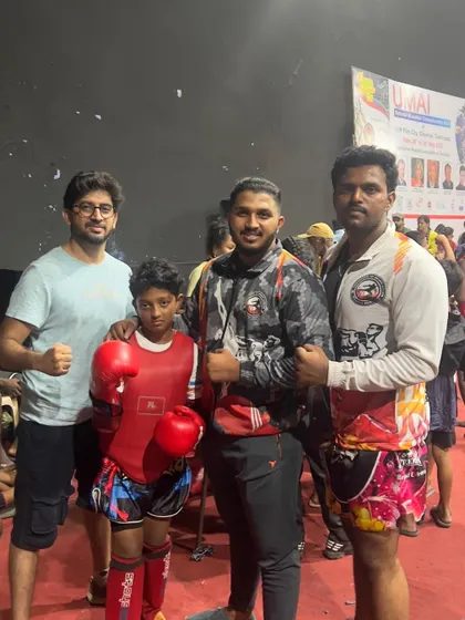 Standing with my fighters at the IFMA National Championships. We are a team, and we face every challenge together.