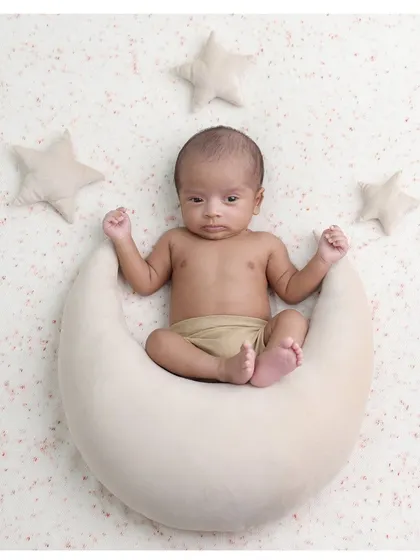 An awake and curious little star-gazer. It's always special when we capture moments with the baby's eyes open, looking right at the camera.