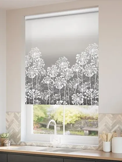 A roller blind with a beautiful white floral silhouette against a grey gradient background. This design is perfect for a kitchen window, adding artistry without sacrificing function.
