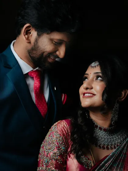 A classic, romantic portrait of the couple, their smiles showing their deep affection for each other.