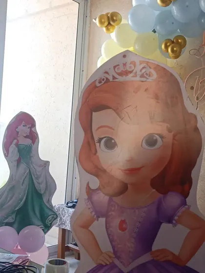 A close-up of the life-sized princess cutouts used in Prisha's birthday decoration.