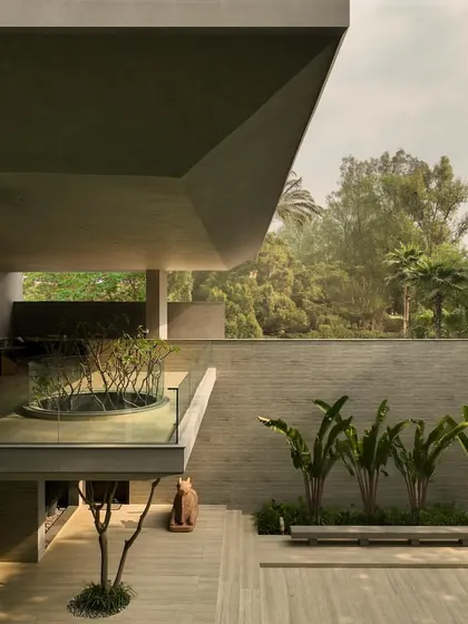 These images show the house as a living space, with glimpses of the pool, lawn, and even the family dogs, grounding the monumental architecture in everyday life.