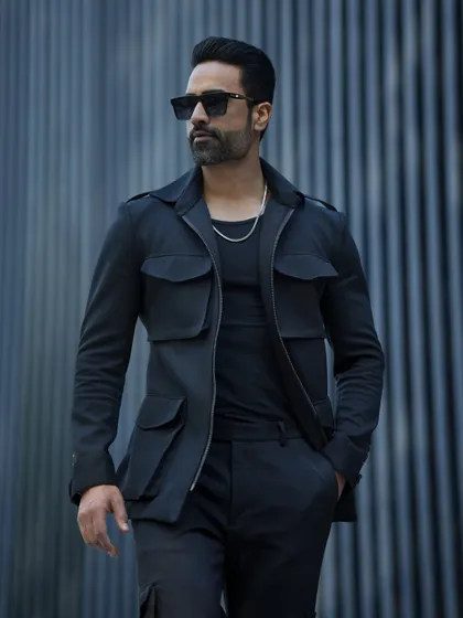 Our GT Tracksuit in black, featuring a stylish four-pocket jacket. This is not your average tracksuit; it's a statement in luxury casual wear.