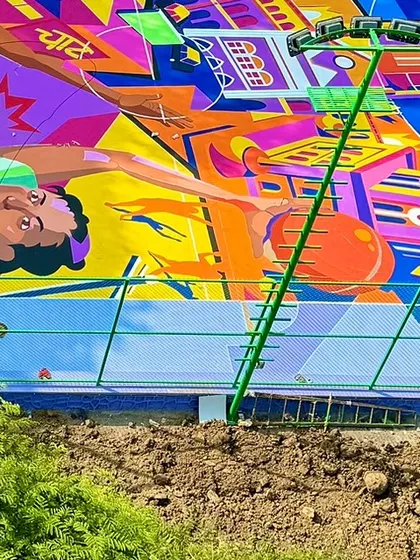A detailed shot of the Mumbai-inspired cityscape within the NBA 2K basketball court mural. I incorporated local motifs like the iconic kaali-peeli taxis to root the artwork in its community.