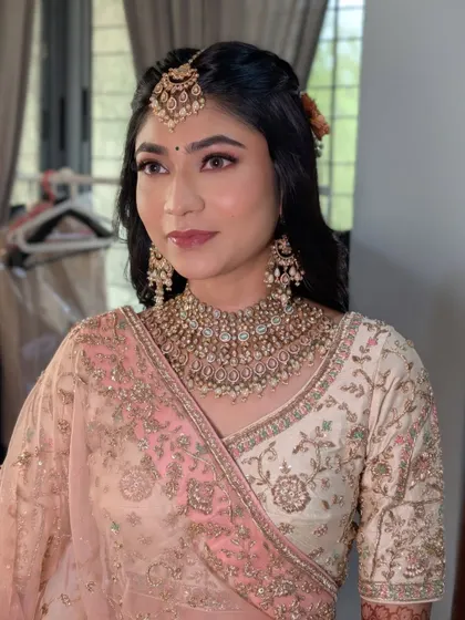 The final wedding look, a perfect blend of soft glam and romantic hair.