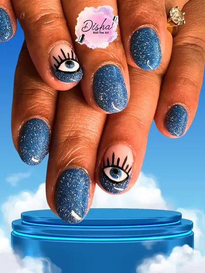Keep the bad vibes away with style. This evil-eye nail art features a sparkling blue base with a detailed, hand-painted eye design for a look that's both trendy and meaningful.
