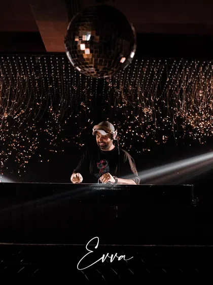 Setting the mood at the start of a long night. The right lighting and opening tracks are key to building the energy for a memorable club experience.