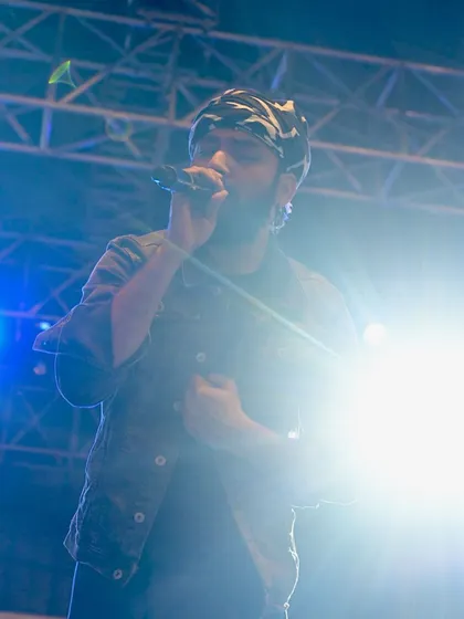 The hustle is real, but the dream is always worth it. This photo was taken during a big festival performance, capturing the energy and passion that goes into every show. It's a reminder of the journey from writing songs in my room to playing under the big lights.