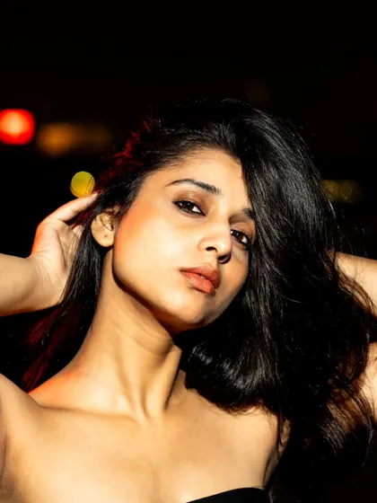 A beautiful close-up beauty shot. The flash provides a clean, crisp light that highlights her features perfectly.