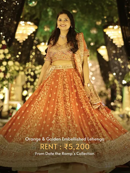 An orange and golden embellished lehenga that will make you sparkle under the festive lights.