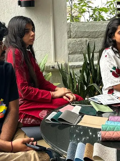 Team members examining fabric samples.
