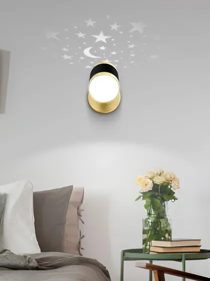 This spotlight wall lamp projects a beautiful star and moon pattern, making it a magical addition to a bedroom.