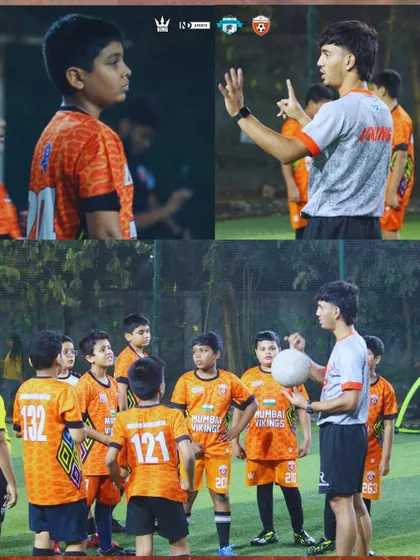 A coach explaining a drill to the U13 squad. Clear communication and instruction are key to our methods.