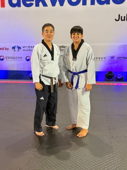 My student with a Taekwondo grandmaster at the event.