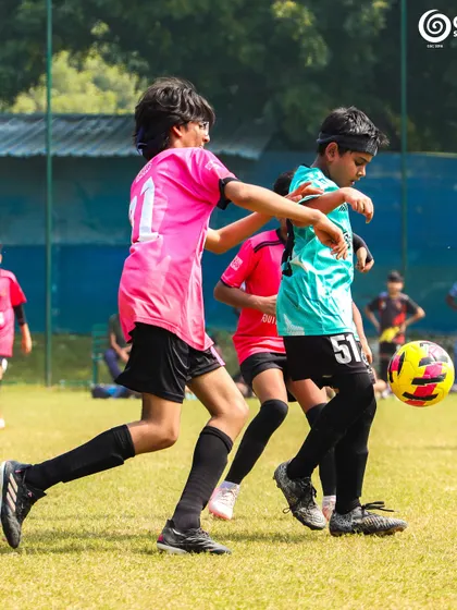 A GSC player dribbles past a Manav Rachna opponent.