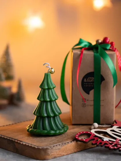 My Christmas tree candle is a hot favorite. Here it is, beautifully packaged and ready to be gifted, with its little bell on top adding a touch of magic.