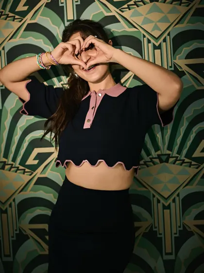 A sweet and playful gesture that shows the fun side of fashion. Style is about expressing all parts of your personality.