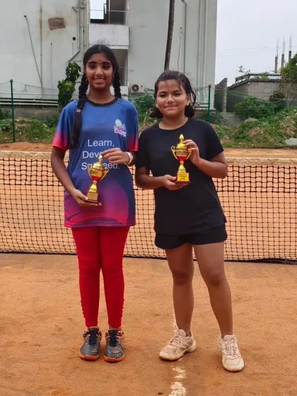 Hamsini and Lawan, our Under 14 finalist and winner, standing side by side. They showcase the healthy competition and sportsmanship we foster among our players.