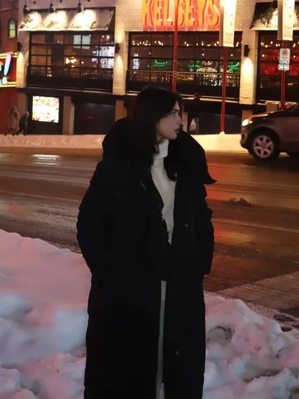 The vibrant lights of Clifton Hill, Niagara Falls, create a fun backdrop for a winter night out.