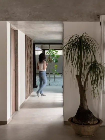 The home is divided into two main parts connected by a gallery. This design separates the common living areas from the private bedrooms, with a sky-lit internal court bringing light into the core of the house.
