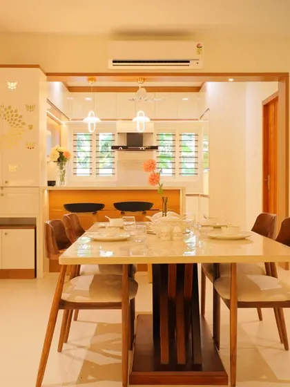 The dining area in the Trivandrum project, which opens into the kitchen, creating a connected and spacious feel for family meals.