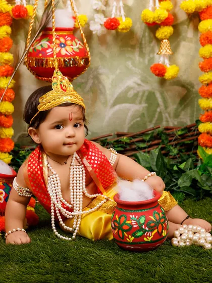 An example of a baby boy dressed as Krishna, showcasing one of the poses and outfits for the Janmashtami shoot.