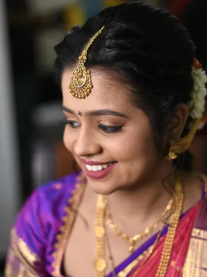 A close-up of this sweet bride's engagement makeup. I created a soft, natural look with a mauve-pink lip and defined brows, complemented by a traditional hairstyle with fresh jasmine flowers.