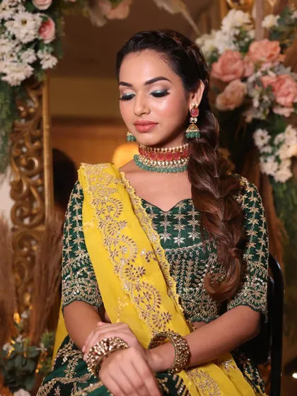 The complete look, with a beautiful braided hairstyle complementing the makeup.