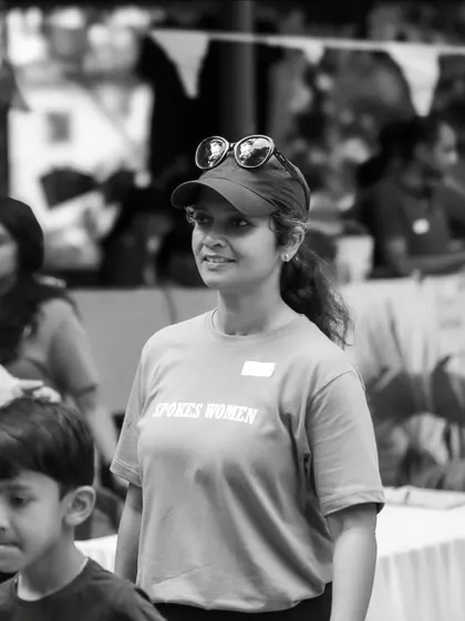 A volunteer in her SpokesWomen tee, helping make the Garage Sale a smooth and fun experience for everyone.