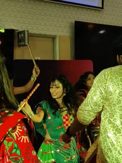 Another angle from the Dandiya night, capturing the movement and vibrant colors of the celebration.