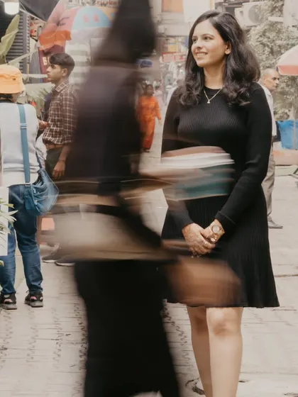 An artistic shot using motion blur to create a dynamic feel of the city moving around the bride-to-be. This creative technique adds a unique, story-driven element to an urban photoshoot.