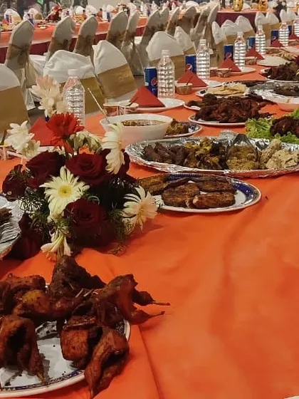 A long table laden with a variety of our dishes. This view shows the abundance and variety I provide, ensuring a grand feast for any celebration.