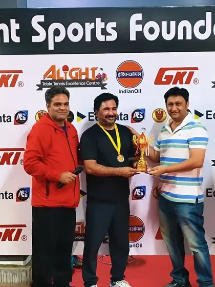 Presenting a trophy to a winner at our corporate open tournament. These events bring together talent from over 80 different companies.