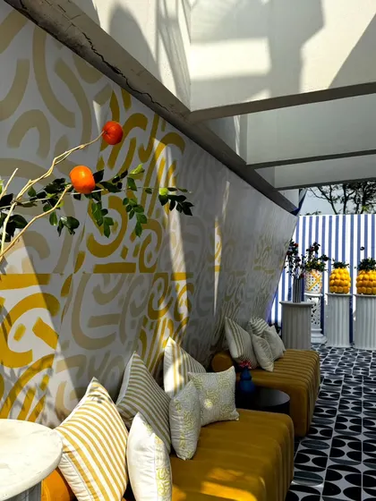 From concept to execution in just 42 hours. This St. Tropez inspired decor in Ahmedabad involved transforming a bungalow with custom-painted walls, fruit-based installations, and unique props, all on a tight deadline.