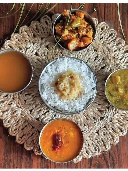 A traditional Andhra thali featuring the Ava Pettina Pulusu, a testament to the state's rich culinary heritage.