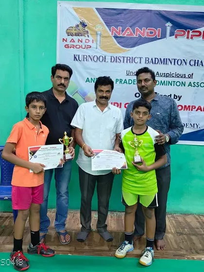 Another photo celebrating Rehaan's victory with his doubles partner. Teamwork makes the dream work.
