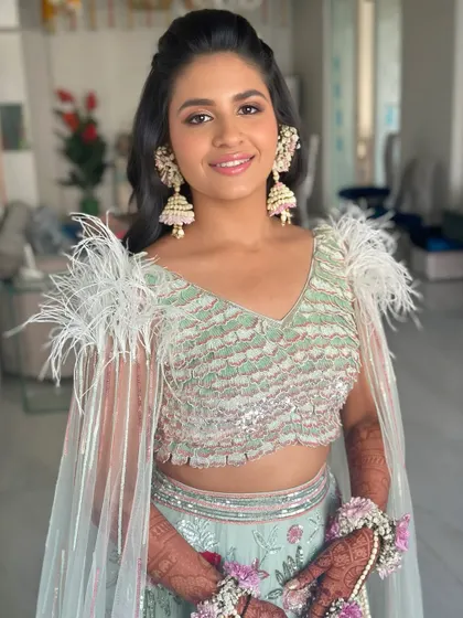Another beautiful shot of this modern Mehendi look, showcasing the flawless skin and soft, flattering makeup tones.