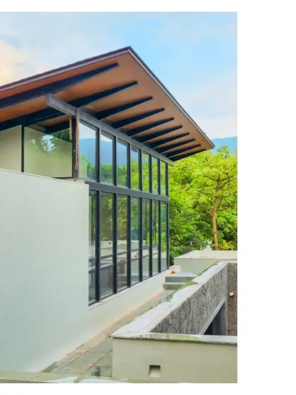 A detail of the House in a Grove, where the architecture becomes a quiet partner to the landscape. The structure is conceived to embrace the grove and encourage life to be lived among the trees.