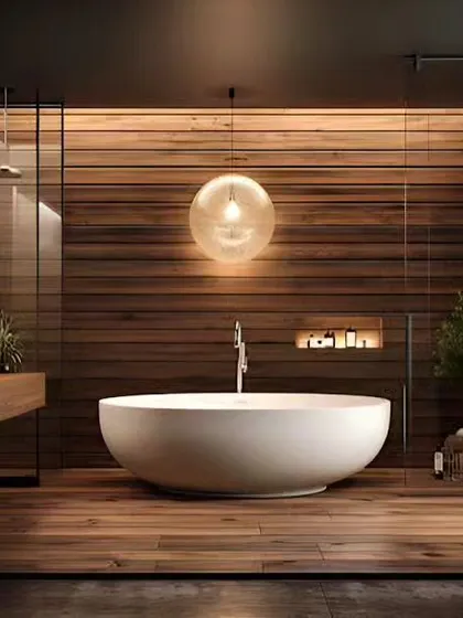 A spa-inspired bathroom with a freestanding bathtub and wood-panelled walls. The warm, ambient lighting creates a deeply relaxing atmosphere.