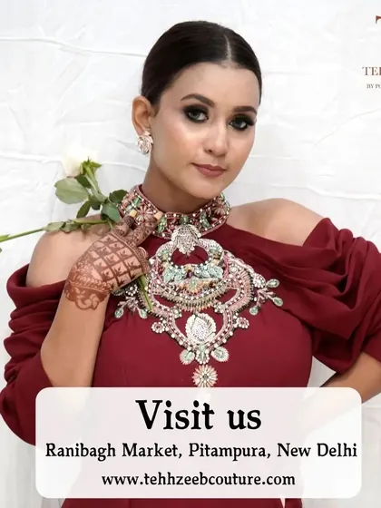 A full look at this elegant maroon gown, perfect for any special occasion. The cold-shoulder design and embellished neckline are modern and timeless.