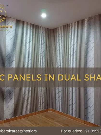 This corner wall installation shows our dual-shade WPC panels with a marble-like texture, creating a sophisticated and seamless look.