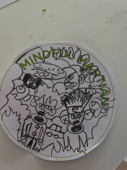 This intricate "Mindful Martian" drawing shows amazing focus and creativity. We encourage every child to explore their artistic side during our craft sessions.
