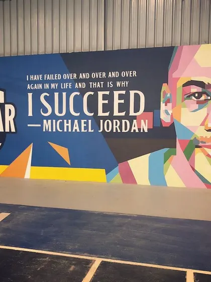 A close-up of the Michael Jordan section of our mural, featuring his famous quote on failure and success. It's a daily motivation for our community.