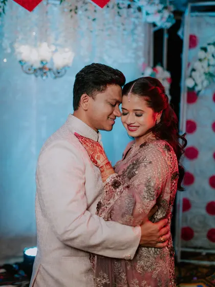 An intimate and romantic embrace between the newly engaged couple.